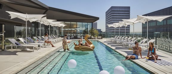 people enjoying the pool at the hyatt regency austin hotel and spa