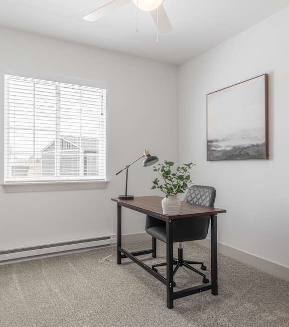 A room with two doors and a carpeted floor.