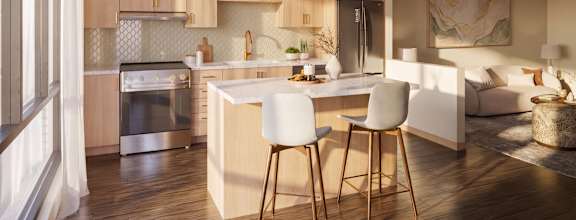 A modern kitchen with a dining table and chairs.