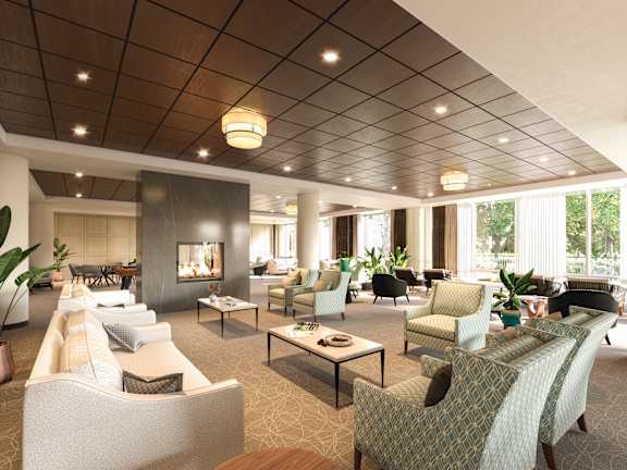 A spacious living room with a variety of seating options and a fireplace.