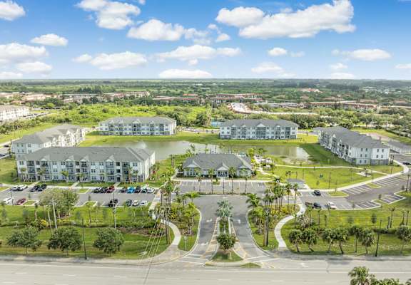 an aerial view of a community with houses and a lake