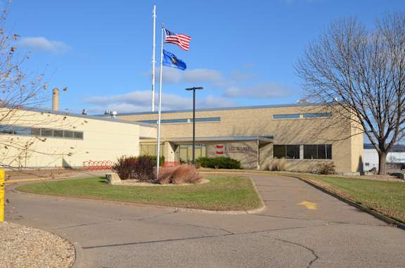 A building with a flag pole in front of it.
