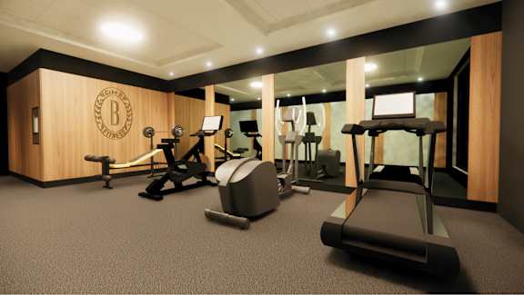 A gym with treadmills, elliptical machines, and other exercise equipment.