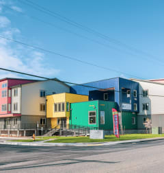 a row of colorful houses on the side of a street