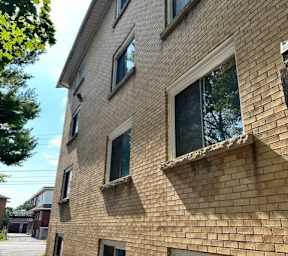 the side of a brick building with windows
