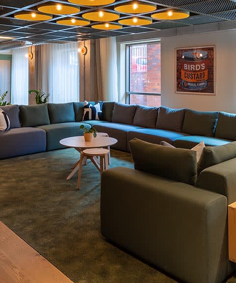 a living room with couches and a coffee table
