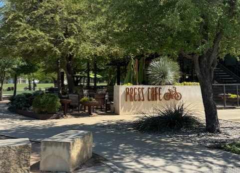 Nearby Local Favorite Press Café with Outdoor Seating Under Shade Trees