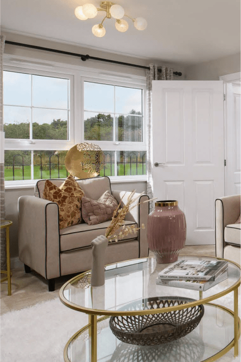 a living room with a couch and a glass table