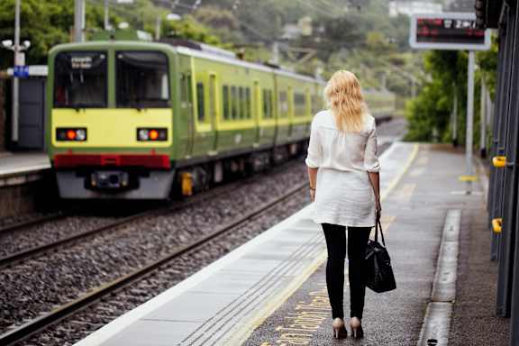 a train on the tracks in an empty city