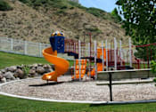 Thumbnail 16 of 26 - Colorful playground with slide and climbing equipment at Liberty Hill Apartments, Draper, 84020