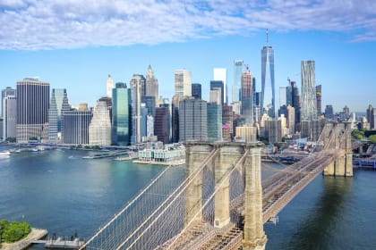 an aerial view of the brooklyn bridge and the city of nyc