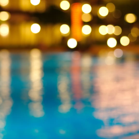 Blurred Photo of Pool and Lights