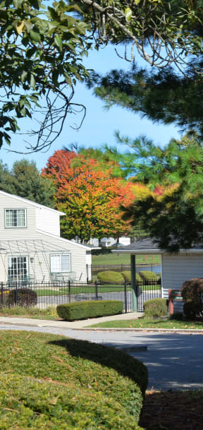 a sign for hunters lake townhome apartments in front of a gazebo
