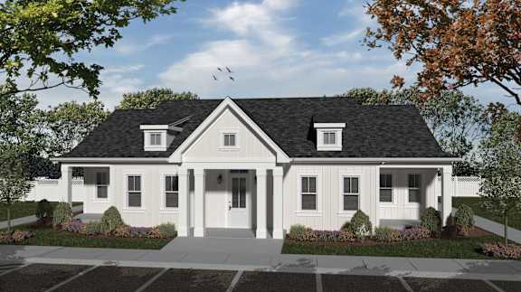 A white house with a black roof and a front porch.