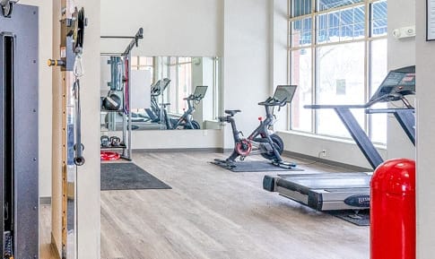 the gym at the central apartments near uptown and downtown