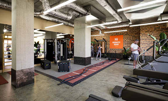 A gym with a red carpet and a sign that says "Kickboxing".