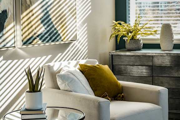 a living room with a couch and a table