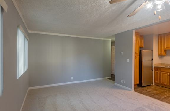 a room with a door open to a bathroom and a closet