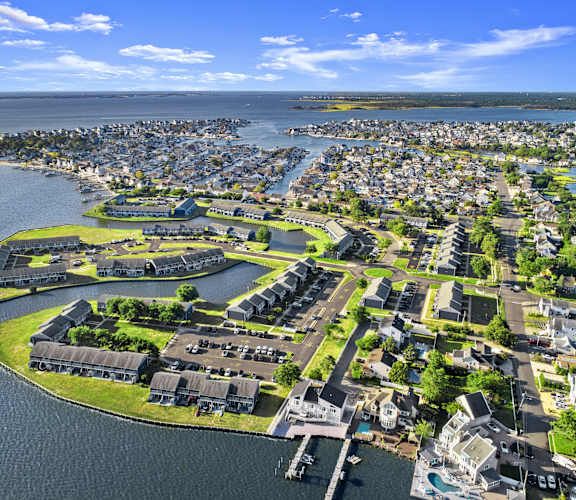 an aerial view of a city on a body of water