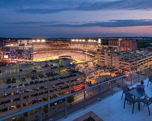 a view of a stadium at night from a balcony