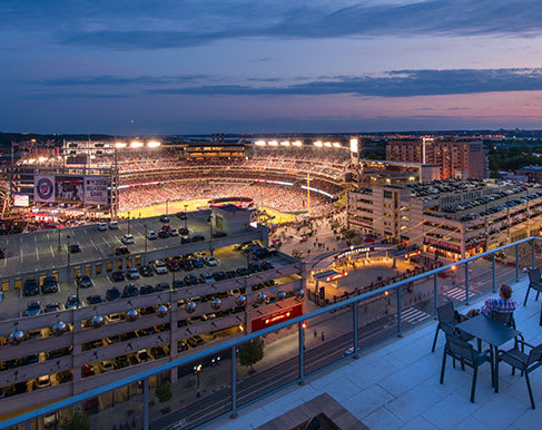 a view of a stadium at night from a balcony