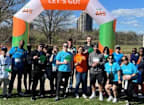 a group of people standing in front of a race