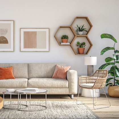 a living room with a couch and shelves on the wall
