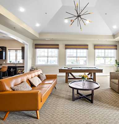 the preserve at ballantyne commons community living room with couches and tables