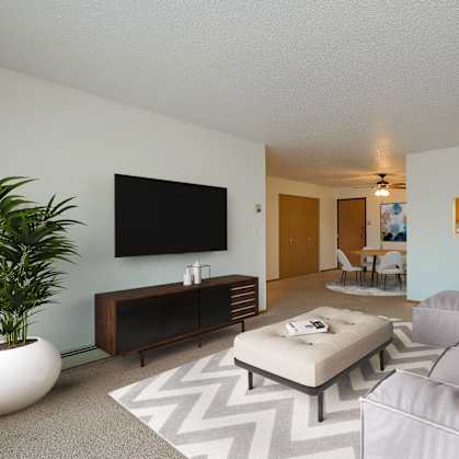 a living room with a large couch and a tv