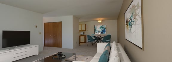 an empty living room with a couch and a television