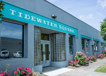 A building with the name Tidewater Square on it.