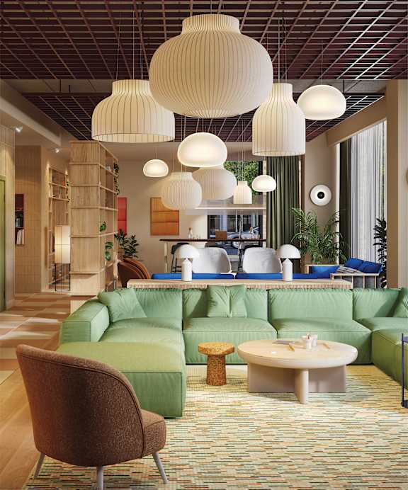 a lobby with a staircase and a table and chairs