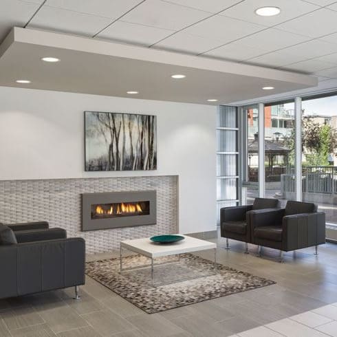 lobby with a seating area and a fireplace