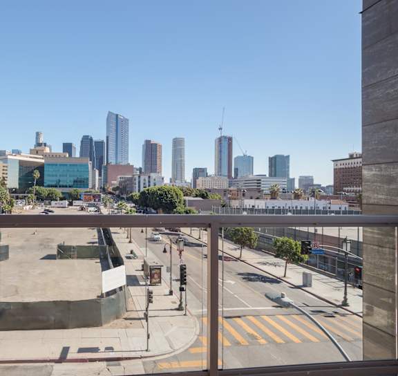 A pier with a Ferris wheel and a roller coaster at Wilshire Valencia Apartment, California