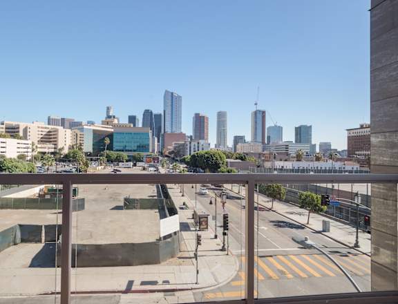 A cityscape with a clear blue sky and buildings of various heights at Wilshire Valencia Apartment, California