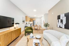 A Living Room With Armchair at Hue Soul Apartments, East Orange, NJ