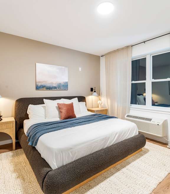 A Bedroom With White Curtains at Hue Soul Apartments, New Jersey, 07018