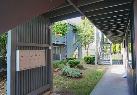 A utility box is on the side of a building.