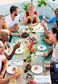 Happy residents dining together at Riverwood Apartments, Akron, OH
