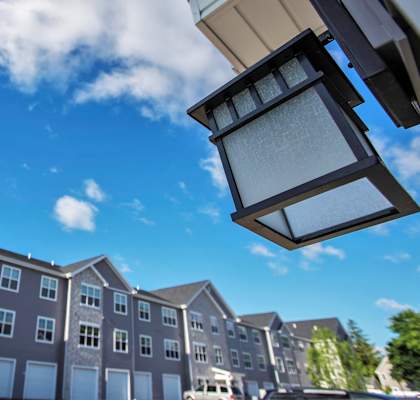 A row of modern apartment buildings under a clear blue sky.