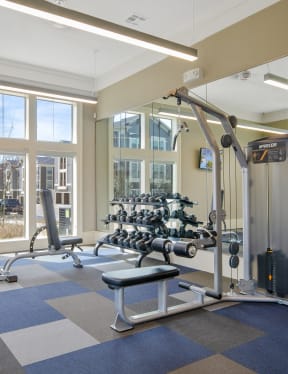 a gym with exercise equipment and windows at the resort at governors crossing