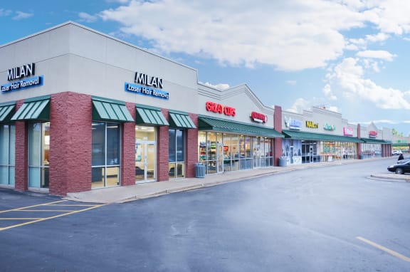 the exterior of a store on the side of a street