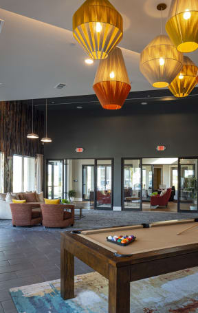 a resident clubhouse with a pool table