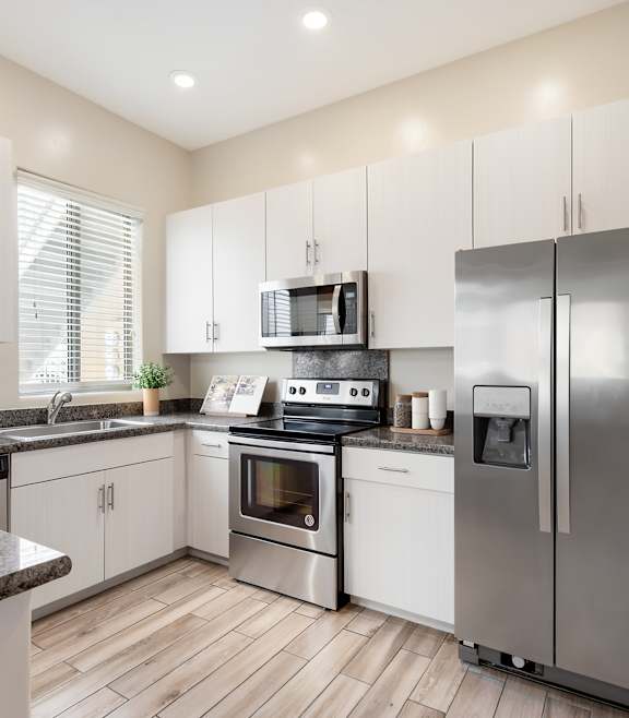 a kitchen with stainless steel appliances and granite counter tops at Pima Canyon, Tucson, 85704