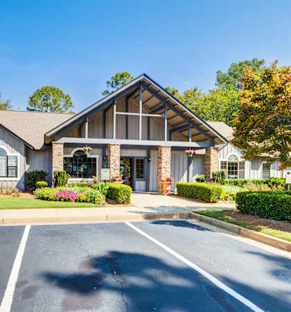 A building with a parking lot in front of it.