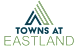A logo with the text "Towns at Eastland" in front of a white background.