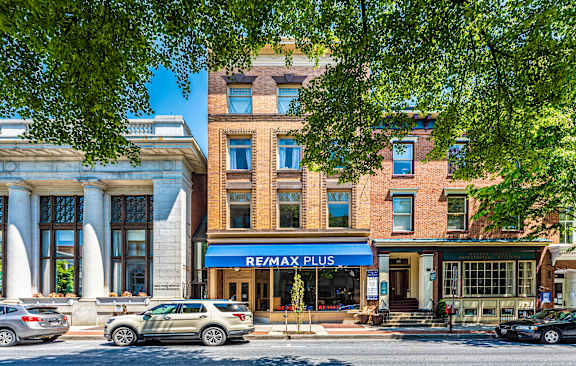 a group of young women and men standing on a city street at Taft Lofts, Frederick, MD