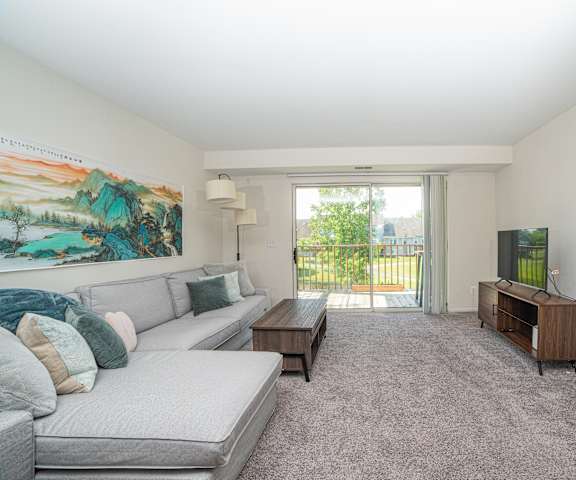 a living room with a couch and a tv