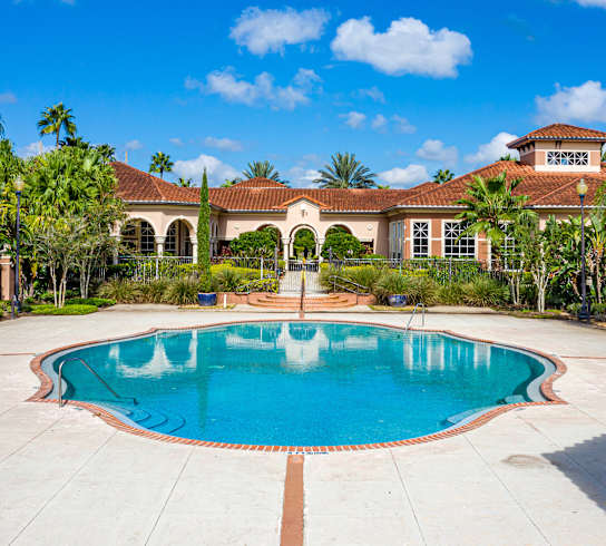 A large house with a pool in the backyard.