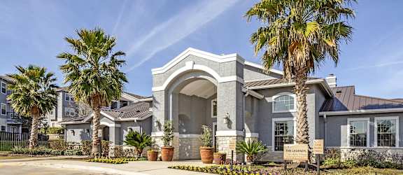 a house with palm trees in front of it